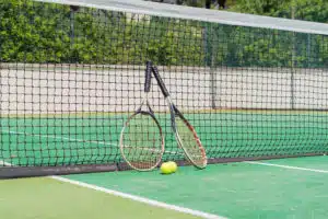 Racket in Tennis court, sport and recreation activity field ground in outdoor national stadium. Green arena. People lifestyle.